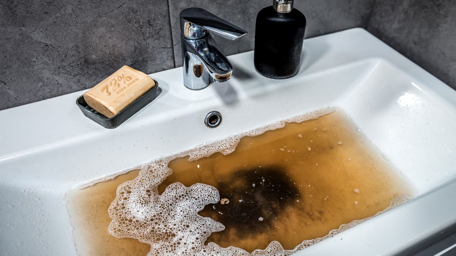 Brown Water in a sink can be a sure sign of a sewer back up - Expert Services of Utah